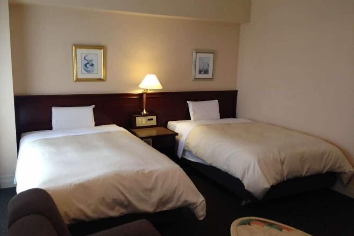 Premium bedding, down duvets, desk, laptop workspace