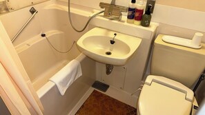 Combined shower/bathtub, hair dryer, slippers, towels