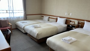 A hotel room with two beds, a desk, a chair, and a nightstand with a phone and clock. - Hotel Tsukuba Hills Gakuen Nishi Odori (Tsukuba)