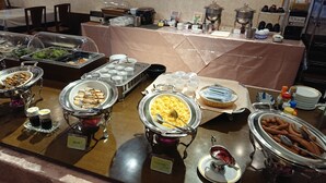 A buffet with various food items and condiments. - Ichikawa Grand Hotel (Ichikawa)