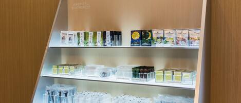 A display of various packaged products on shelves in a store.