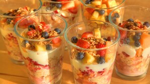 A close-up of parfait glasses filled with layers of yogurt, granola, and fresh fruits. - Ashdowns of Dover B&B (Dover)