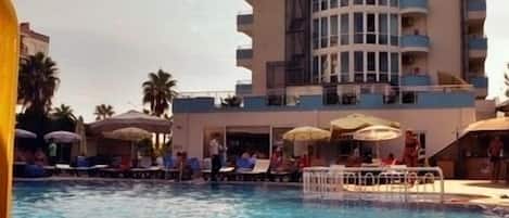 Outdoor pool, pool umbrellas, sun loungers