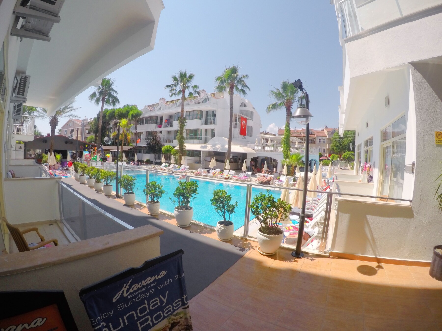 2 outdoor pools, open 8:00 AM to 8:00 PM, pool umbrellas, pool loungers