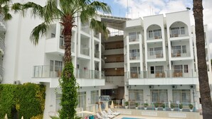 A multi-story hotel with balconies, a pool area, and lush greenery. - Club Atrium Marmaris (Marmaris)