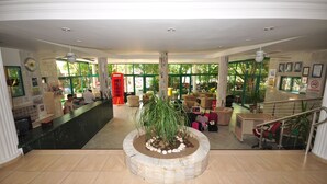A spacious lobby with a reception desk, seating area, and a staircase. - Club Atrium Marmaris (Marmaris)