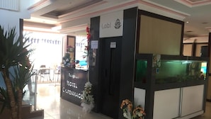 A reception desk with a sign reading "Lobi Hotel Copehenage." - Copenhagen Hotel (Alanya)