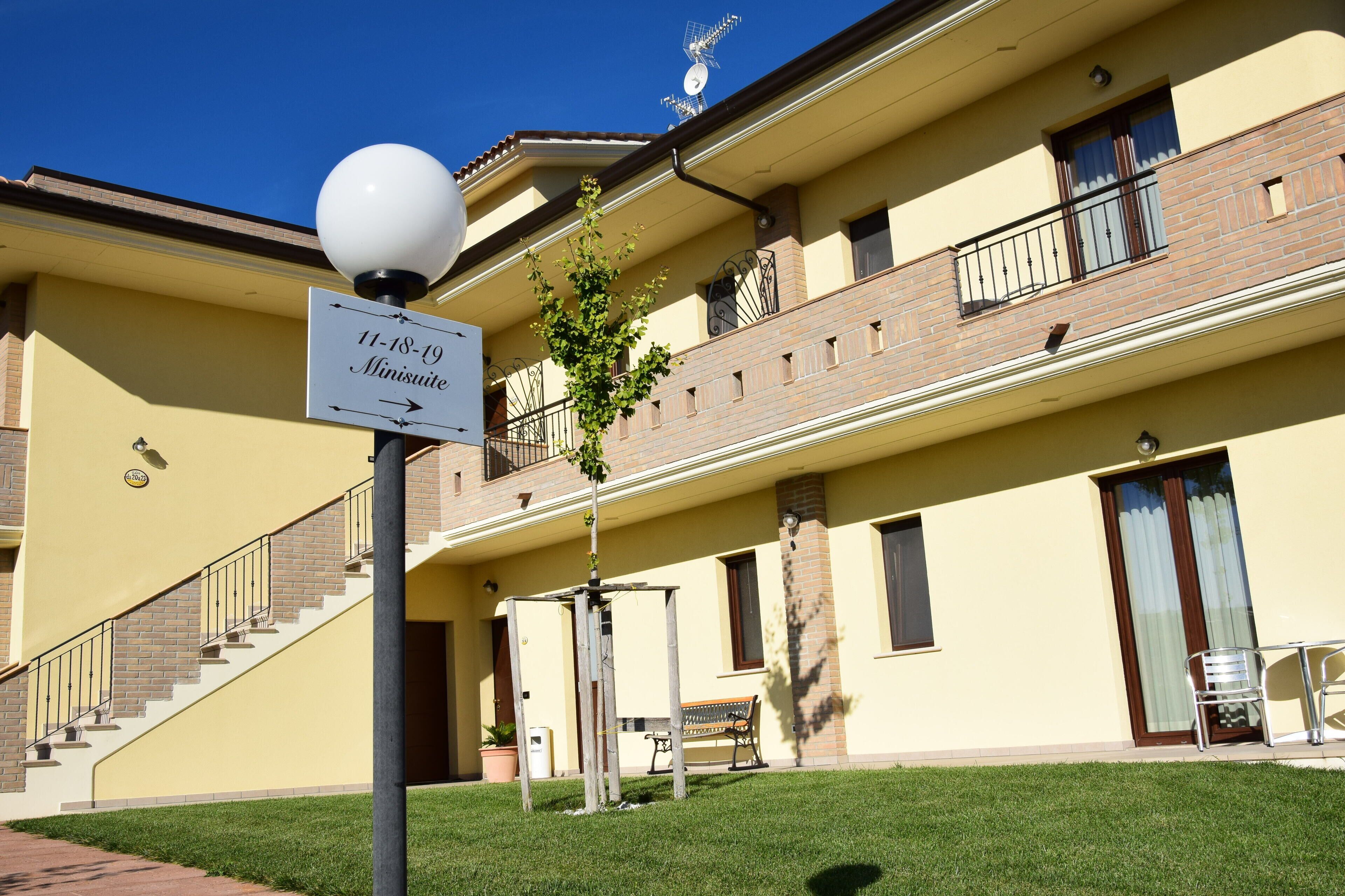 A building with a sign indicating room availability from 11-18-19.