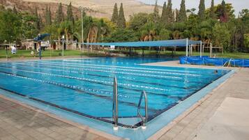 Seasonal outdoor pool, pool umbrellas, sun loungers