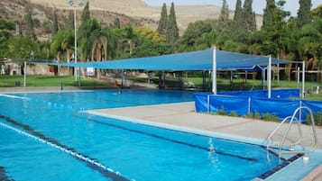 Seasonal outdoor pool, pool umbrellas, sun loungers