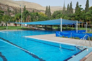 Seasonal outdoor pool, pool umbrellas, pool loungers