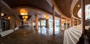 A spacious lobby with high ceilings, large columns, and a polished marble floor. - LTI Dolce Vita Sunshine Resort (Golden Sands)