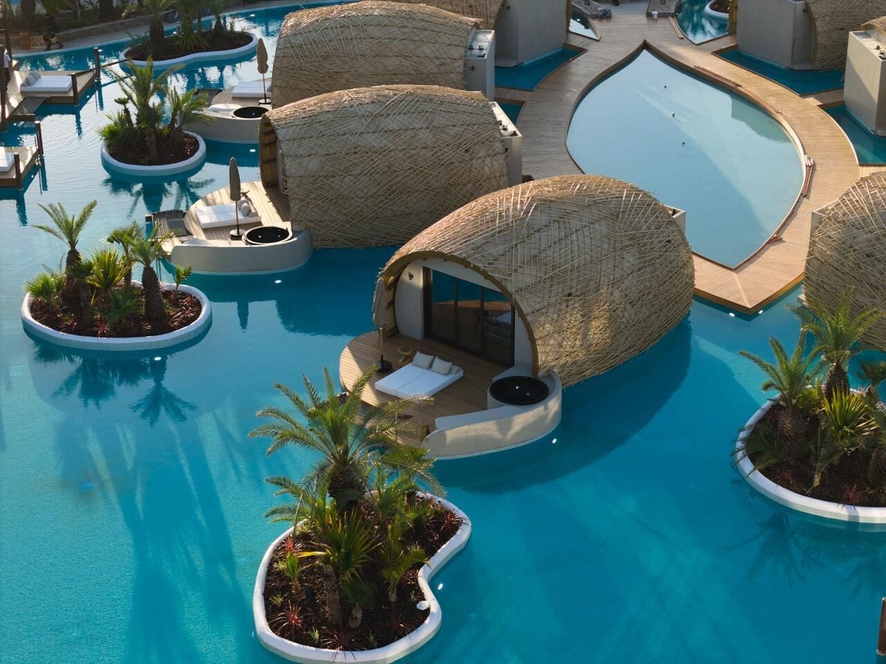 A pool area with circular seating areas and a central pool.