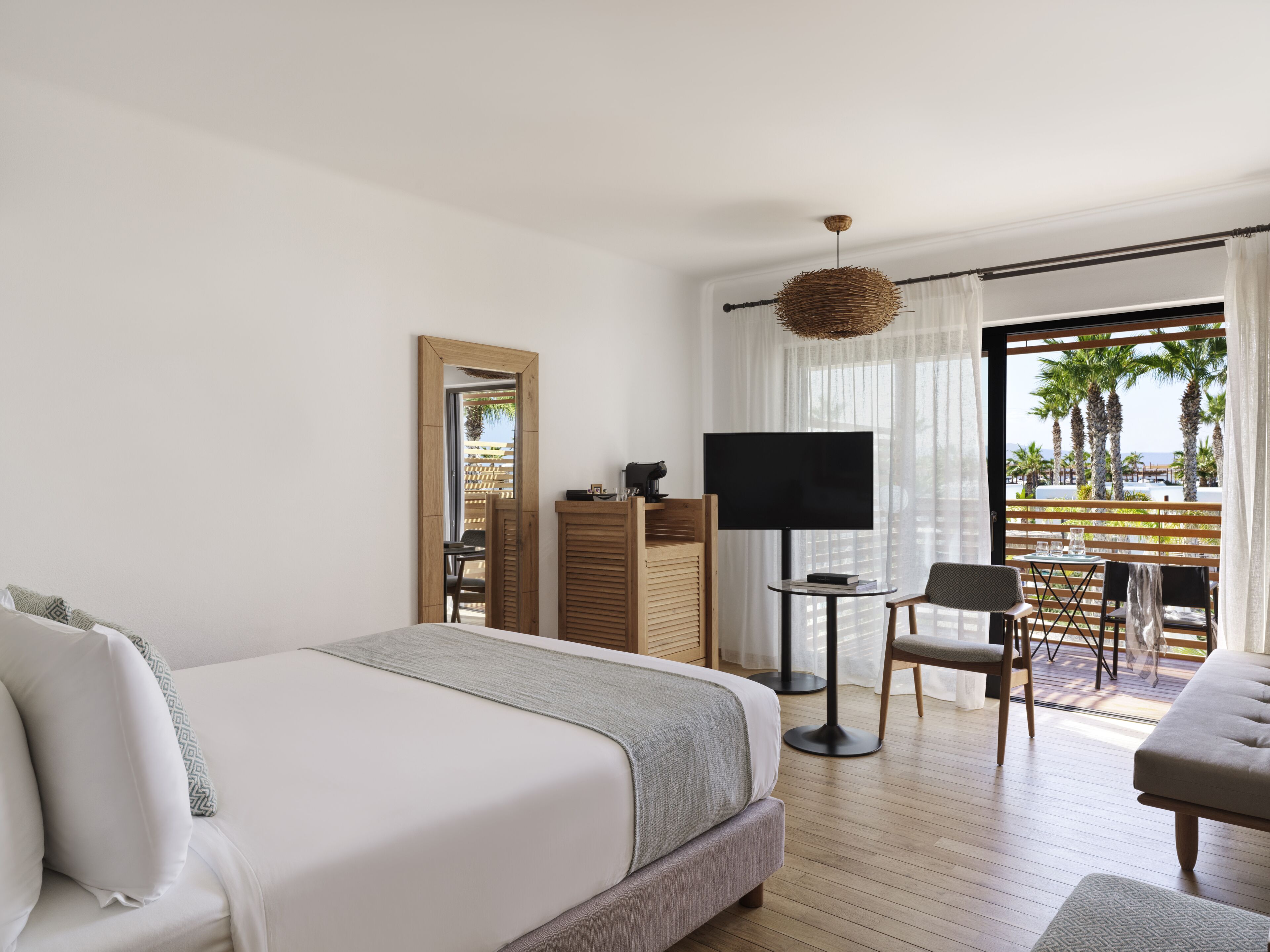 Luxury Room, Pool View | Minibar, in-room safe, desk, soundproofing