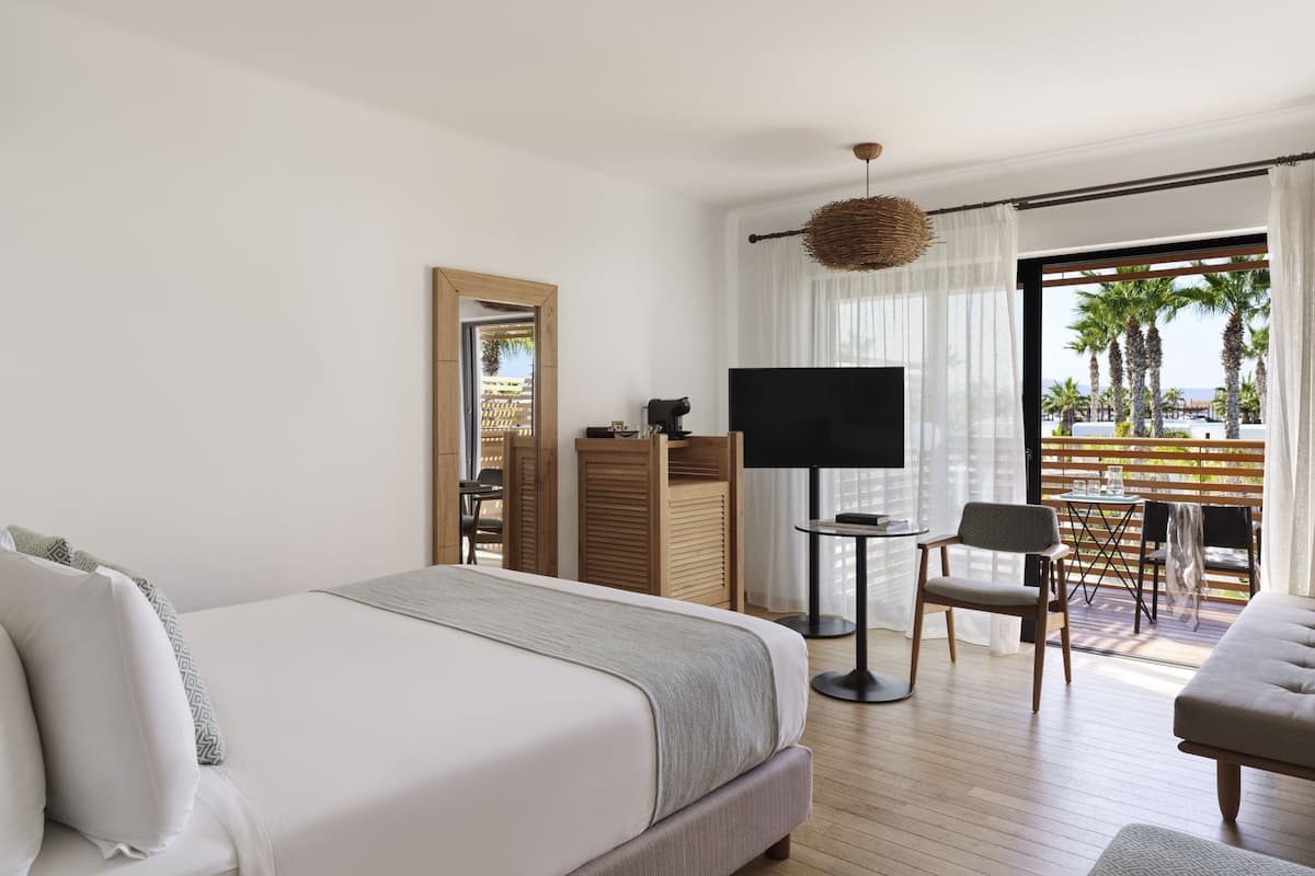 Luxury Room, Pool View | Minibar, in-room safe, desk, soundproofing