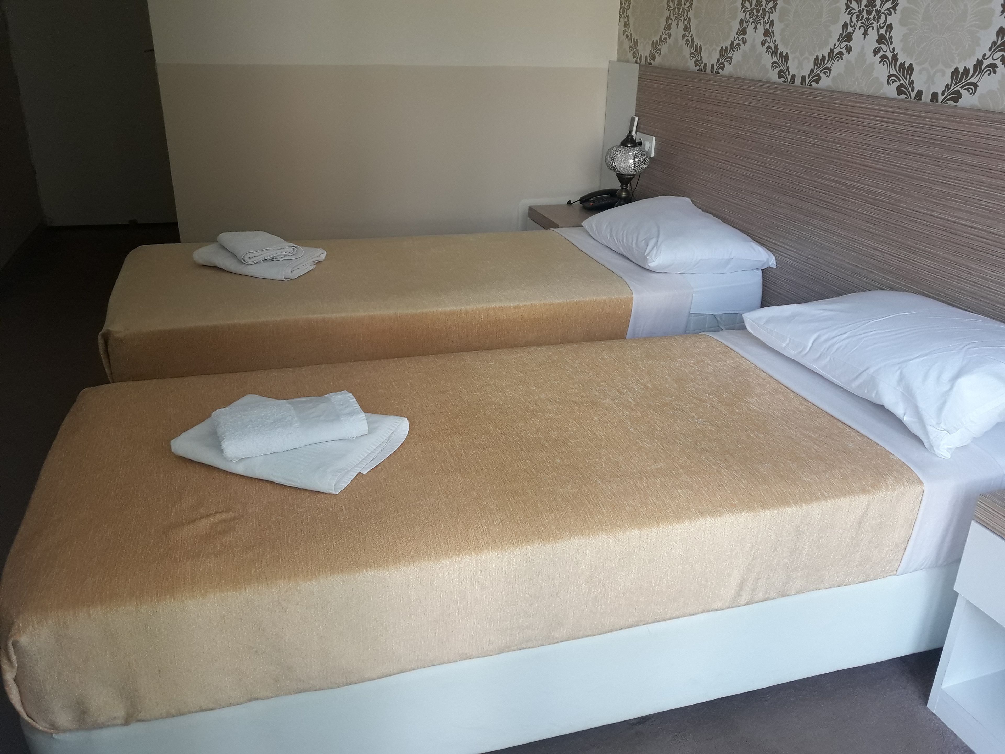 standard twin room, 2 single beds, balcony, garden view | desk, laptop workspace, free wifi, bed sheets