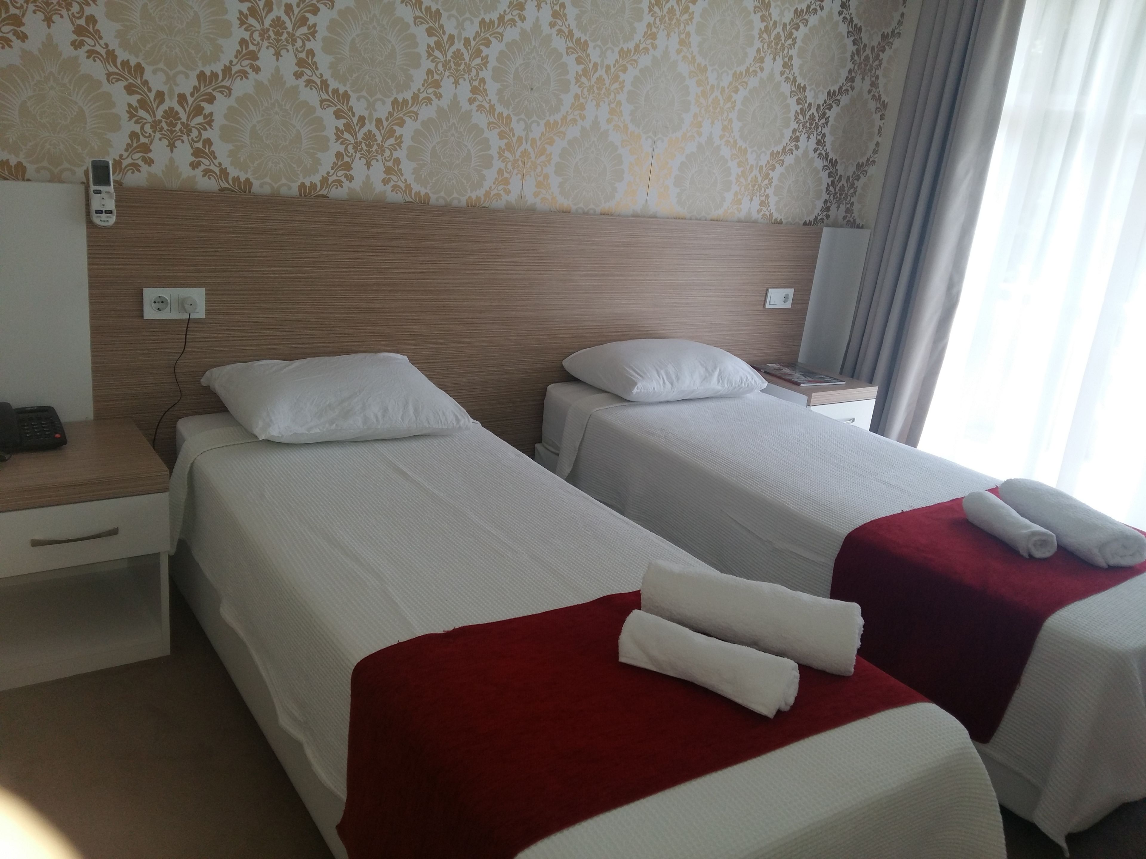 standard twin room, 2 single beds, balcony, garden view | desk, laptop workspace, free wifi, bed sheets