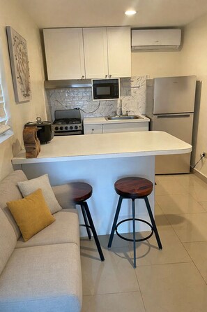 Apartment 216 | Private kitchen | Mini-fridge, microwave, coffee/tea maker - Starz Hotel (St. Thomas)