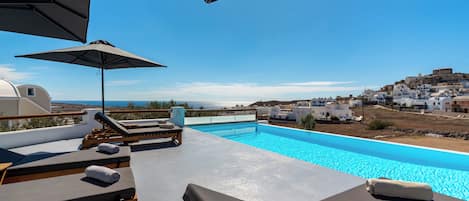 Seasonal outdoor pool, pool umbrellas, pool loungers