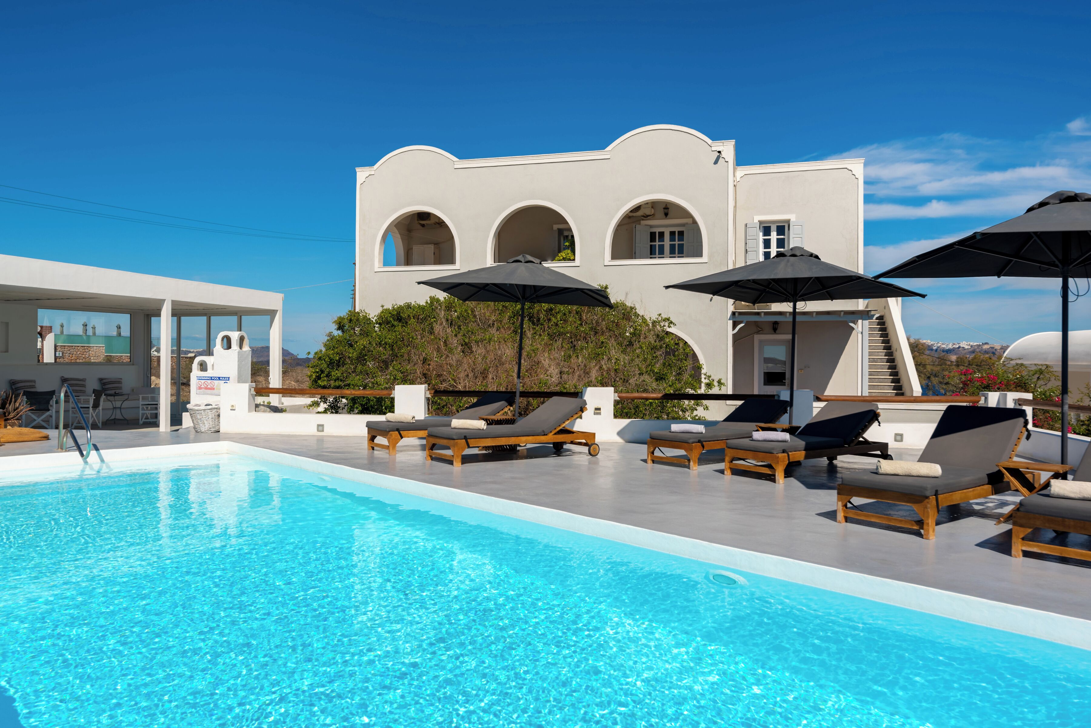 Seasonal outdoor pool, pool umbrellas, pool loungers