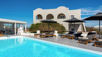 Seasonal outdoor pool, pool umbrellas, pool loungers