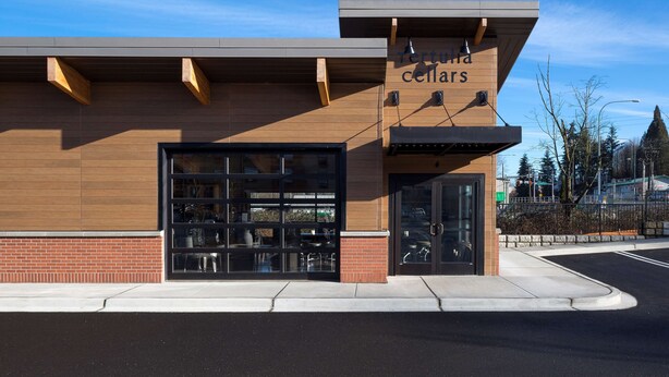 A building with a sign reading "Terraria Cellars" and a large garage door. - Hampton Inn & Suites-Seattle Woodinville WA (Woodinville)