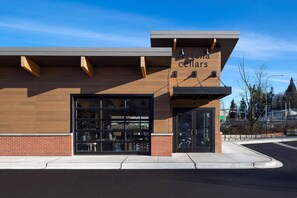 A building with a sign reading "Terraria Cellars" and a large garage door. - Hampton Inn & Suites-Seattle Woodinville WA (Woodinville)