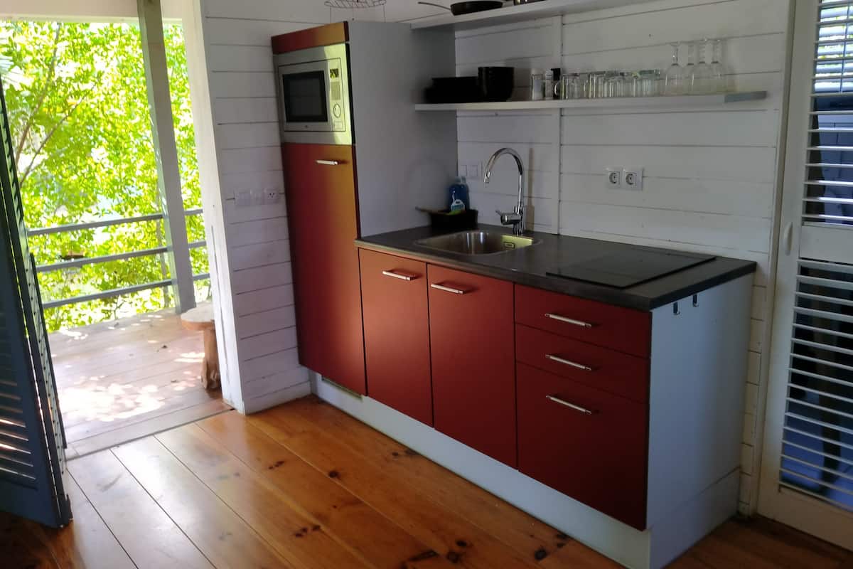 chalet, 2 bedrooms | private kitchen | full-sized fridge, oven, stovetop, cookware/dishes/utensils