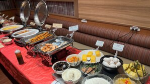 A buffet with various food items and labels. - Asakusa Central Hotel (Tokyo)