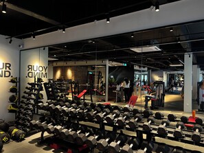A gym with various exercise equipment, including dumbbells and weight machines. - The Smith House (Langkawi)