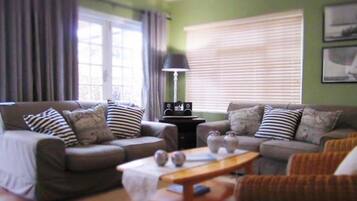 Self-Catering House | Living room | Flat-screen TV, fireplace, books, stereo