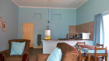 Self-catering units - One Bedroom | Living room | Flat-screen TV