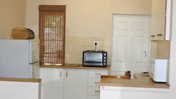 Unit 1 - Two-bedroom; four sleeper | Private kitchenette | Fridge, microwave, electric kettle, cookware/dishes/utensils