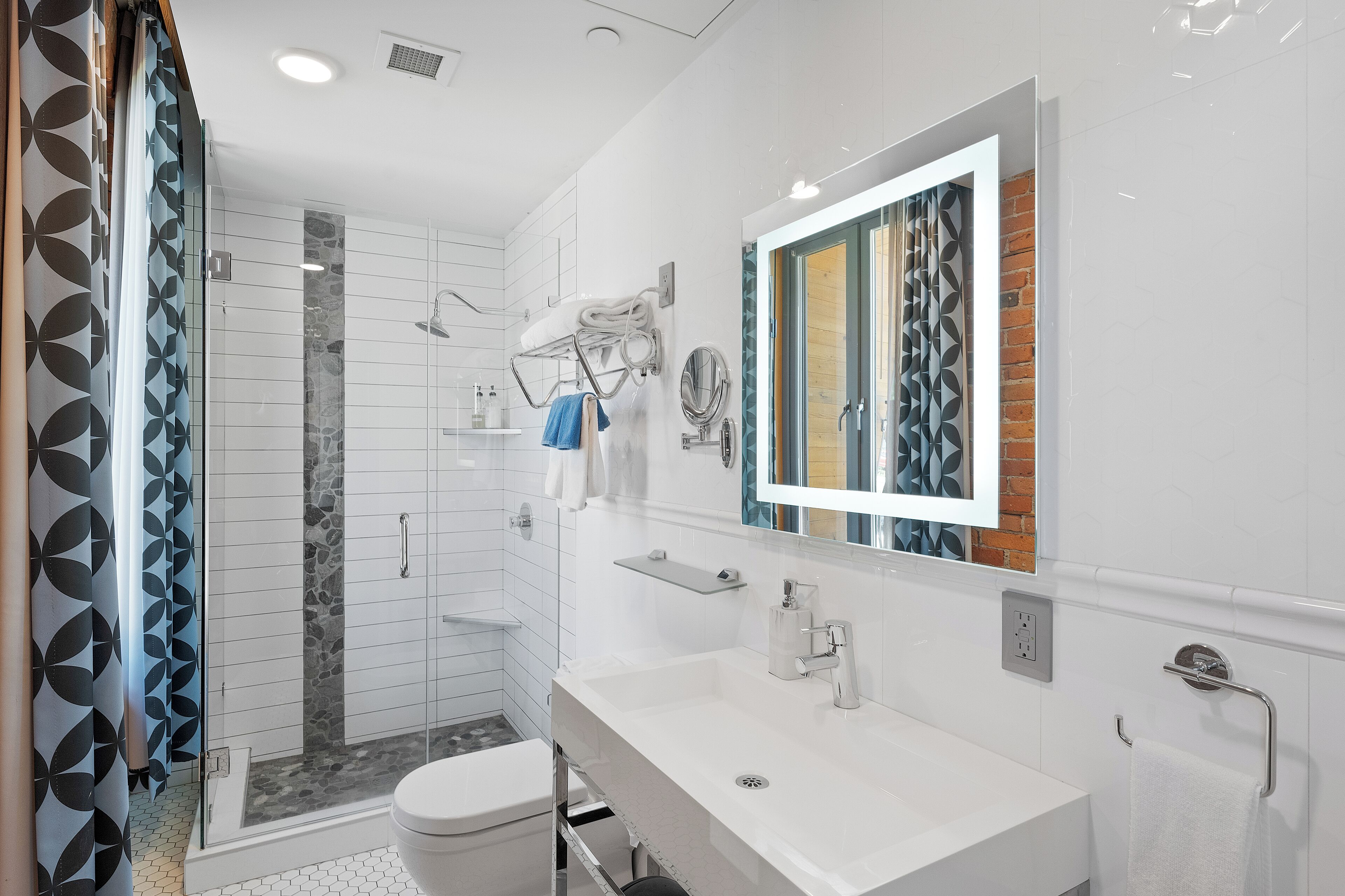 junior suite, 1 king bed | bathroom | shower, rainfall showerhead, designer toiletries, hair dryer