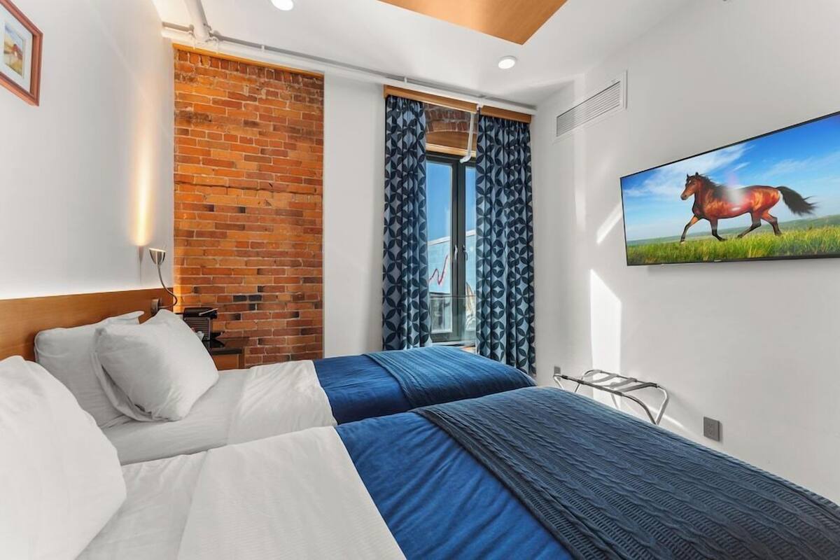 Premium bedding, pillow-top beds, desk, blackout curtains