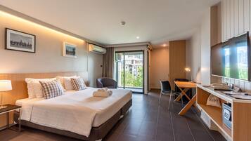 Deluxe Room, 1 King Bed, Balcony | In-room safe, desk, blackout curtains, iron/ironing board