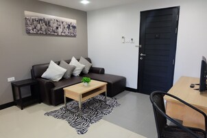 Superior Room | Living area | 32-inch LCD TV with cable channels, TV