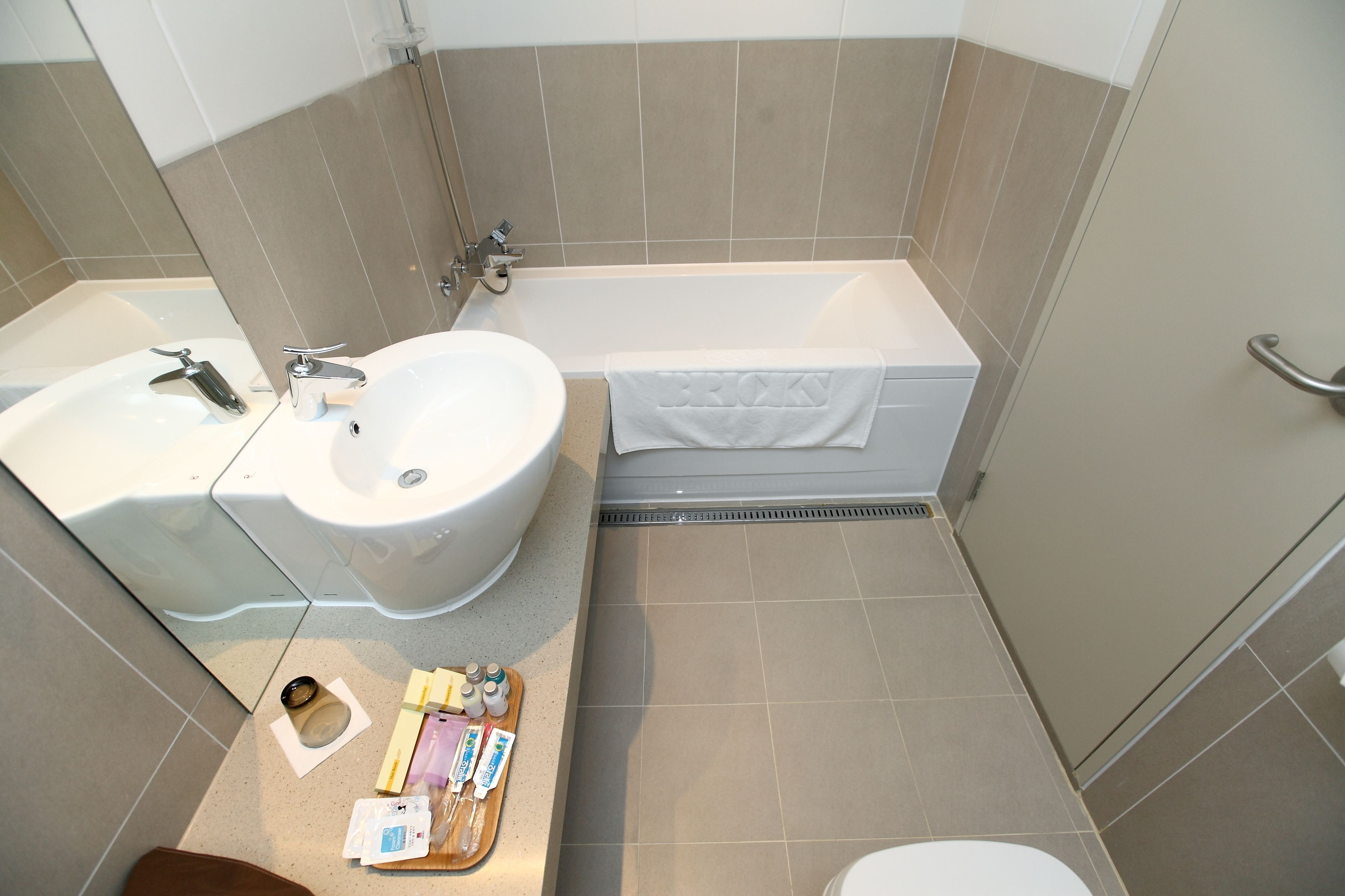 deluxe room | bathroom | designer toiletries, hair dryer, dressing gowns, slippers