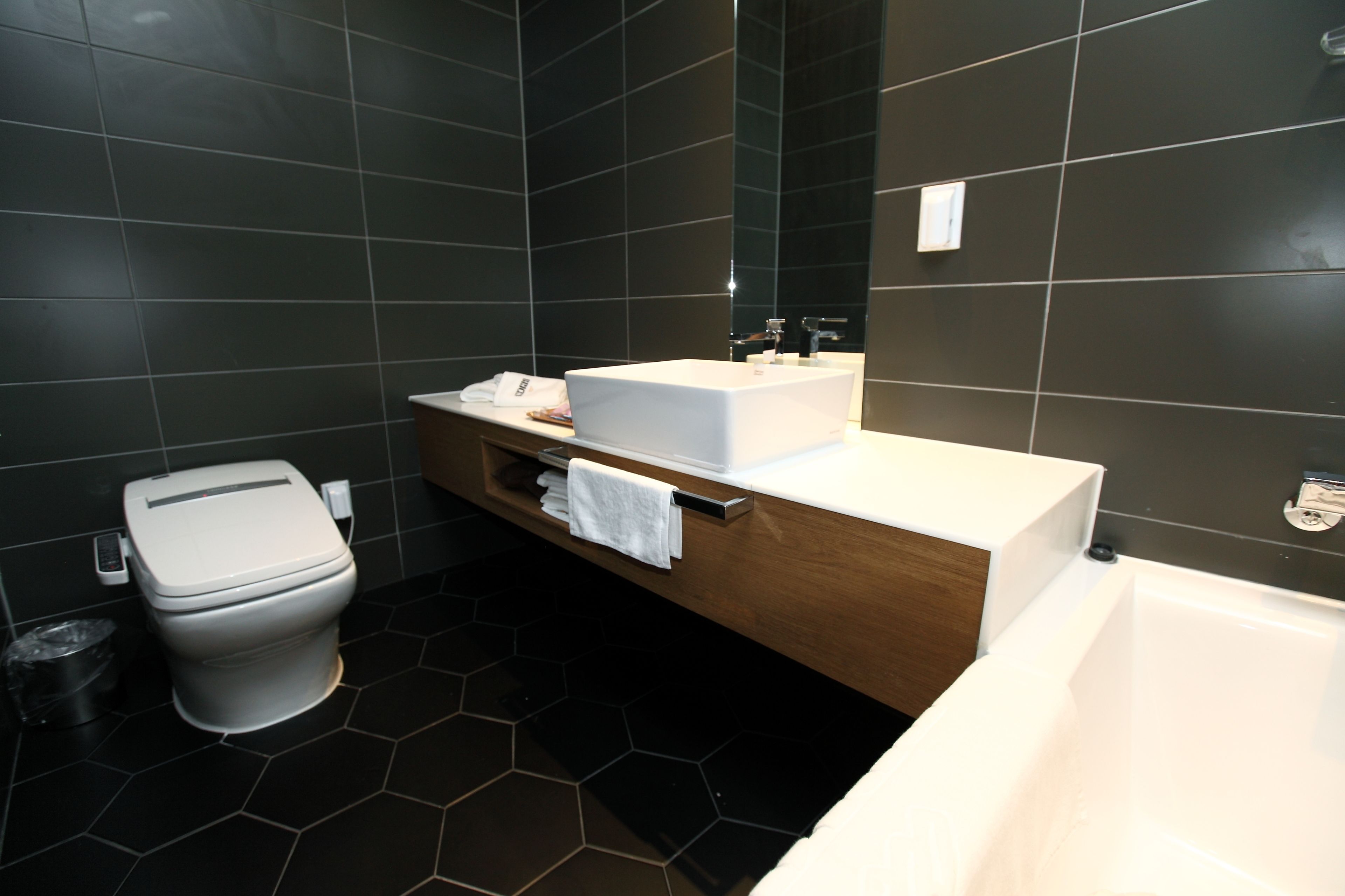 deluxe double room | bathroom | designer toiletries, hair dryer, dressing gowns, slippers