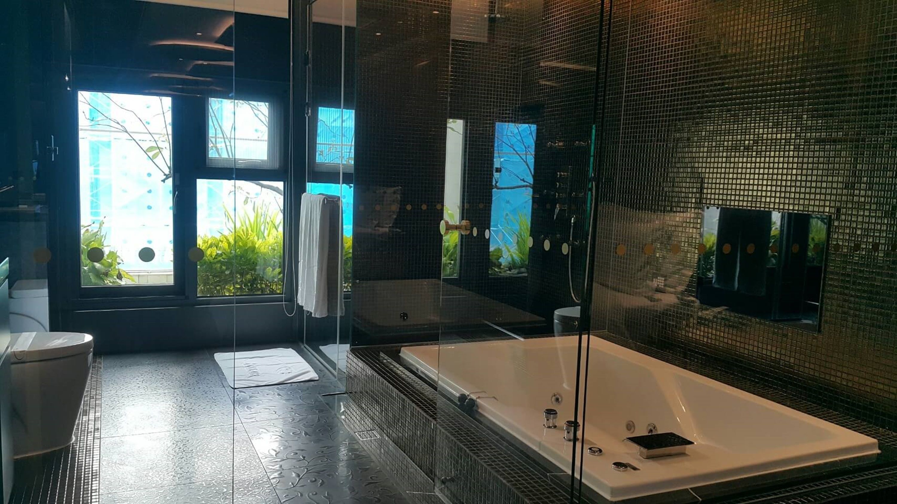 taitanium suite | bathroom | separate bathtub and shower, free toiletries, hair dryer, slippers