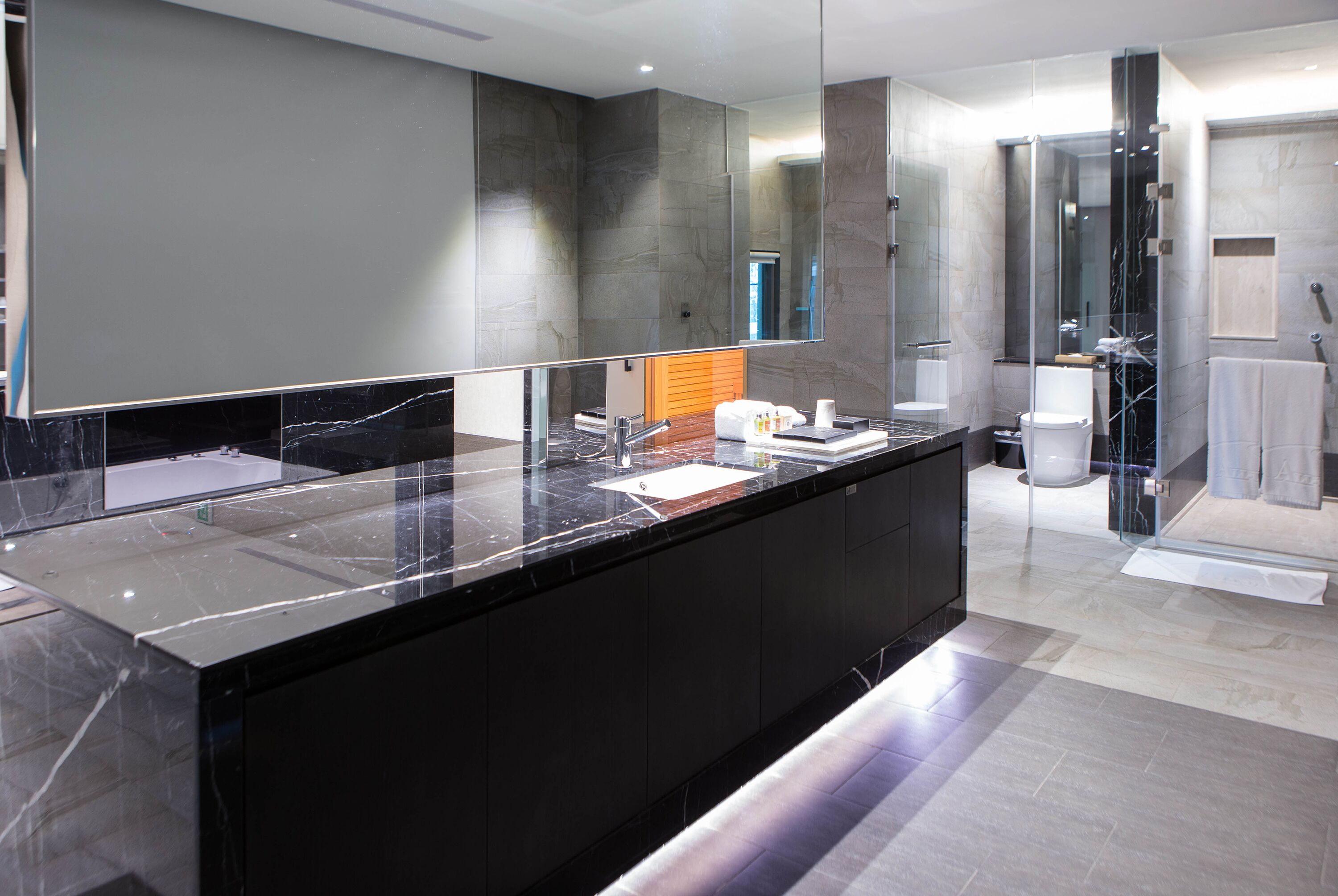 flagship suite (check in time starts from 6pm) | bathroom | separate bathtub and shower, free toiletries, hair dryer, slippers