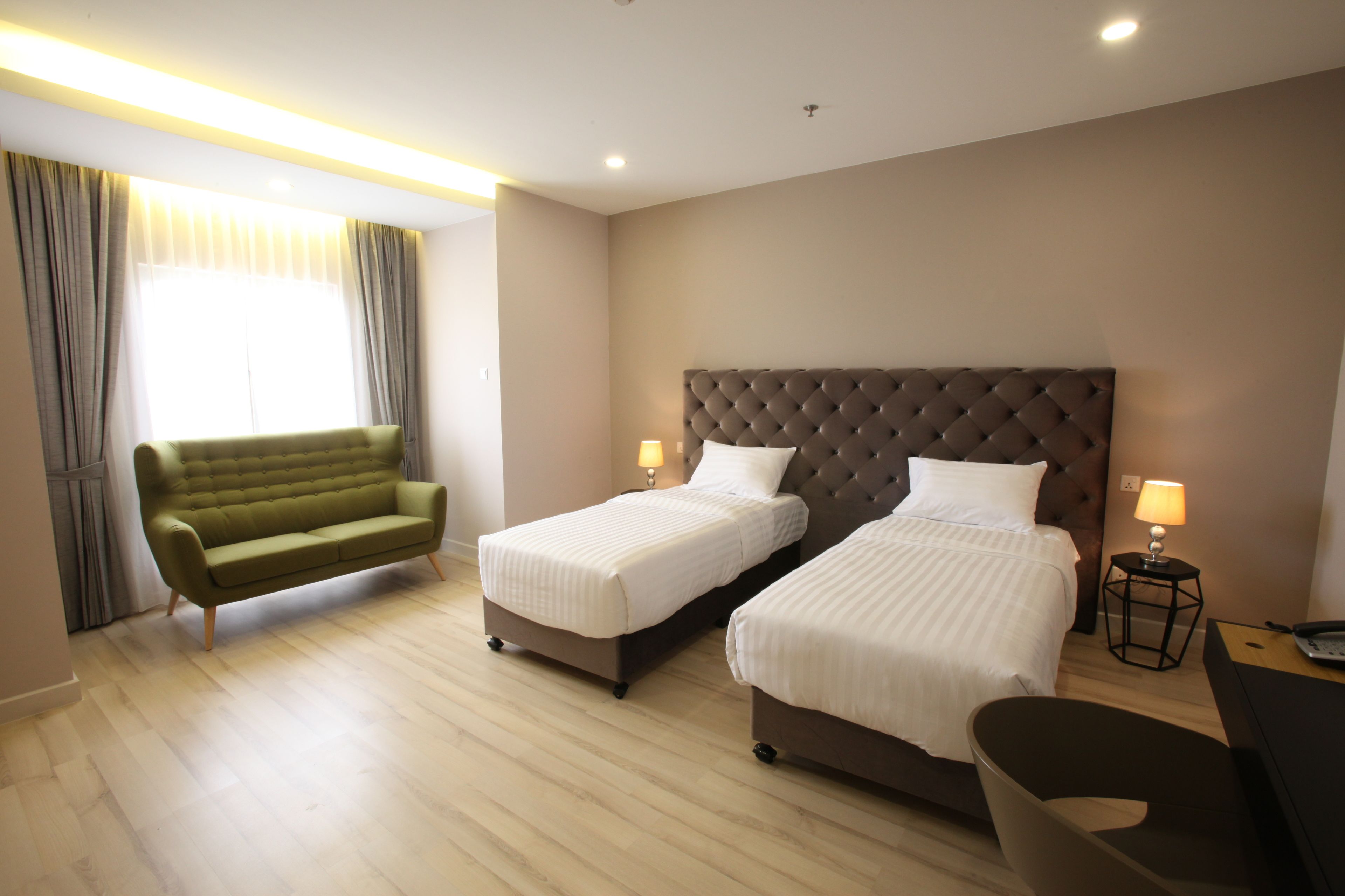 deluxe twin room | in-room safe, desk, cots/infant beds, rollaway beds