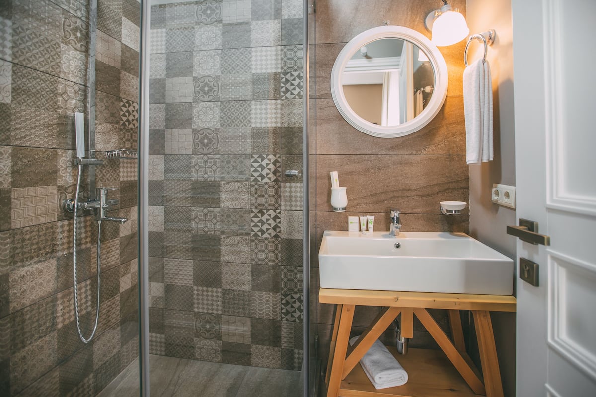 compact double or twin room, no windows | bathroom | shower, free toiletries, slippers, towels