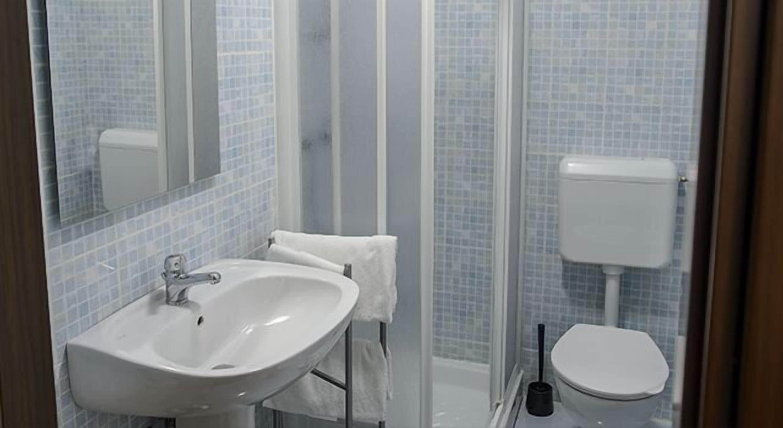 shower, hair dryer, slippers, bidet