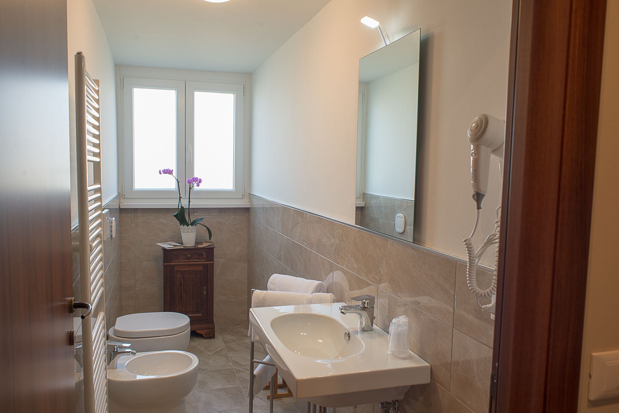 shower, hair dryer, slippers, bidet