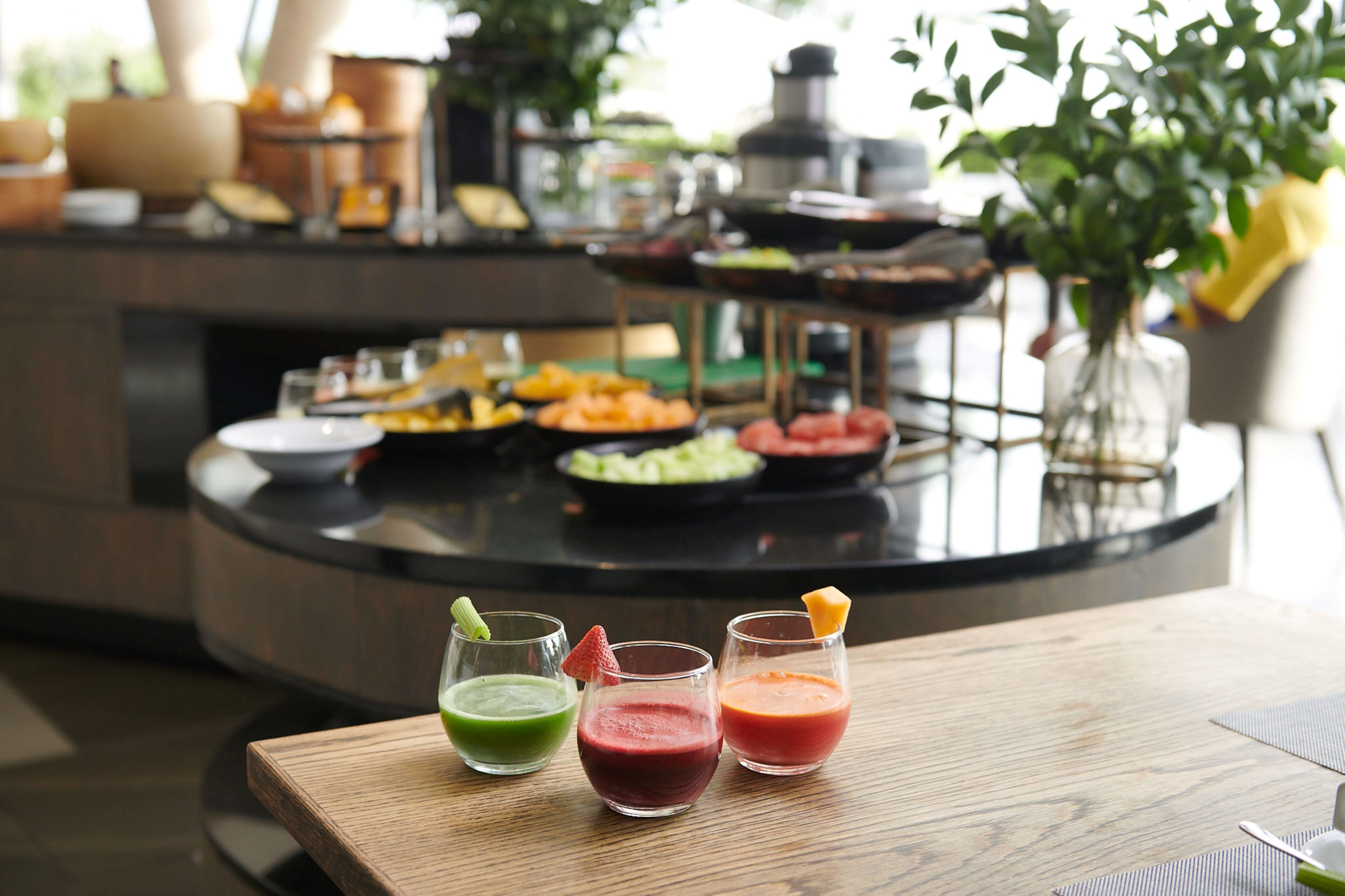 A buffet table with various dishes and drinks.