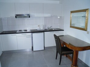 Shared Dormitory, Men only, Shared Bathroom (1 Bed in a 9 Person Room) | Private kitchenette | Fridge, microwave, stovetop, coffee/tea maker