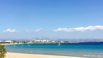 On the beach, beach cabanas, sun-loungers, beach umbrellas