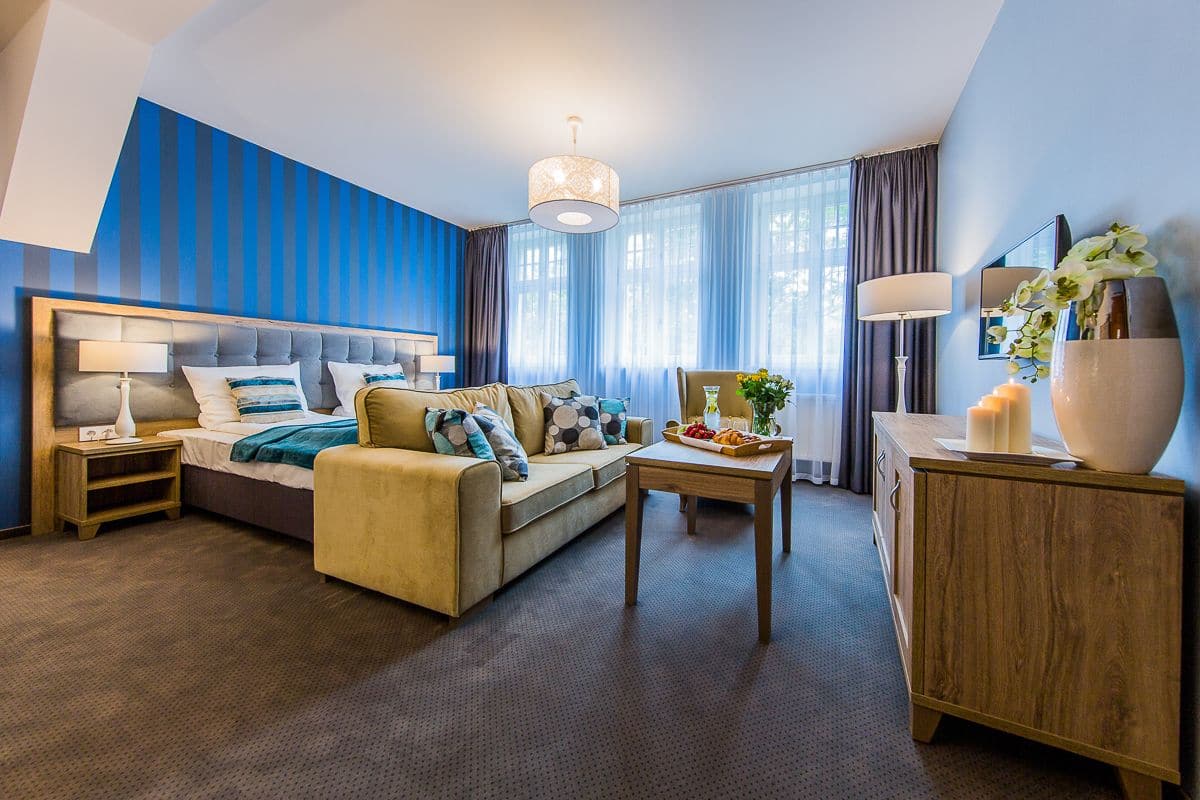 deluxe double or twin room, park view | in-room safe, desk, iron/ironing board, cots/infant beds