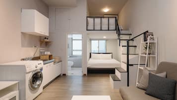 Signature Twin Room, 2 Double Beds | Living area | 32-inch LED TV with cable channels, TV